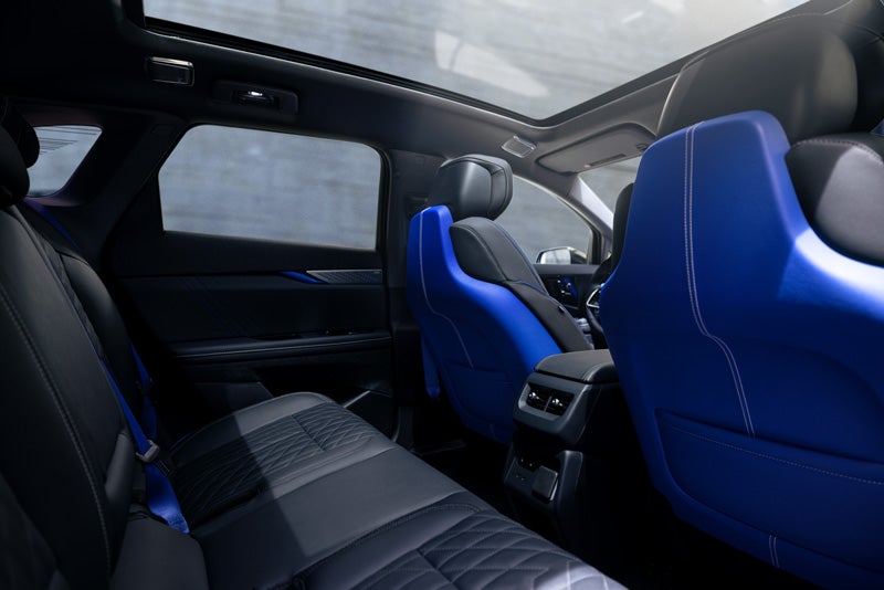 Back Seat View of the 2026 OPTIQ-V Blue Front Seats, Sun Roof, and Interior | Bomnin Cadillac Nanuet in Nanuet NY